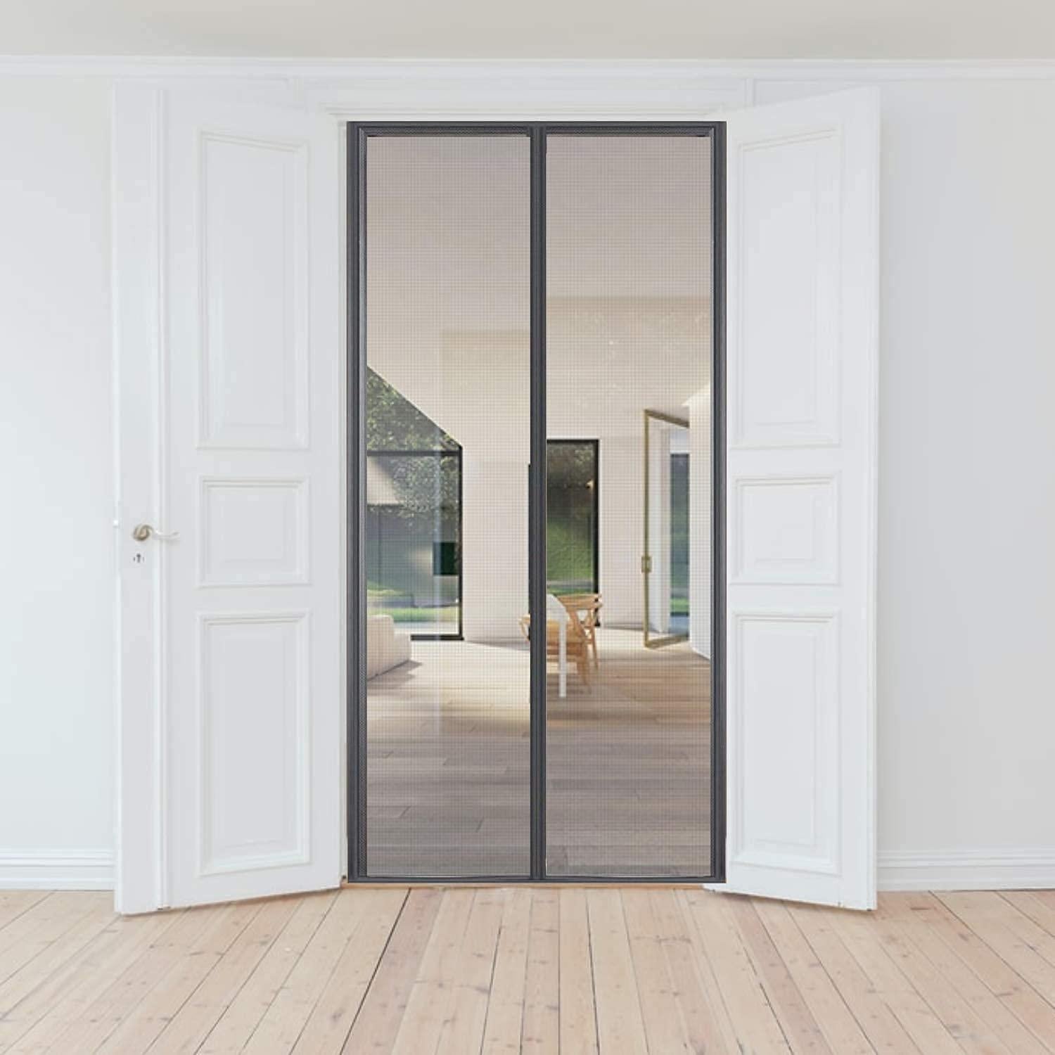 Modern interior door with glass panels in a minimalistic room.
