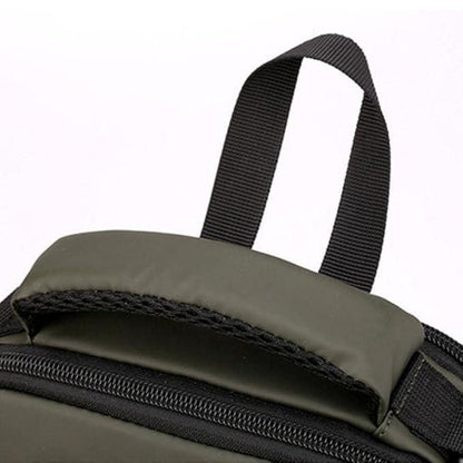 Close-up of a green backpack with a black strap on a white background