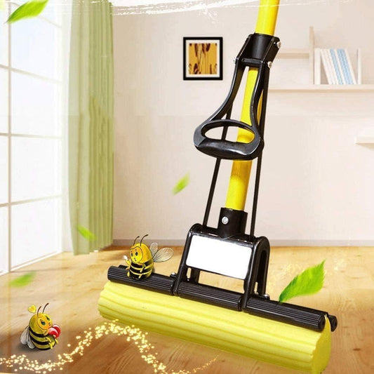 Yellow and black cleaning tool with cartoon bees on a wooden floor.